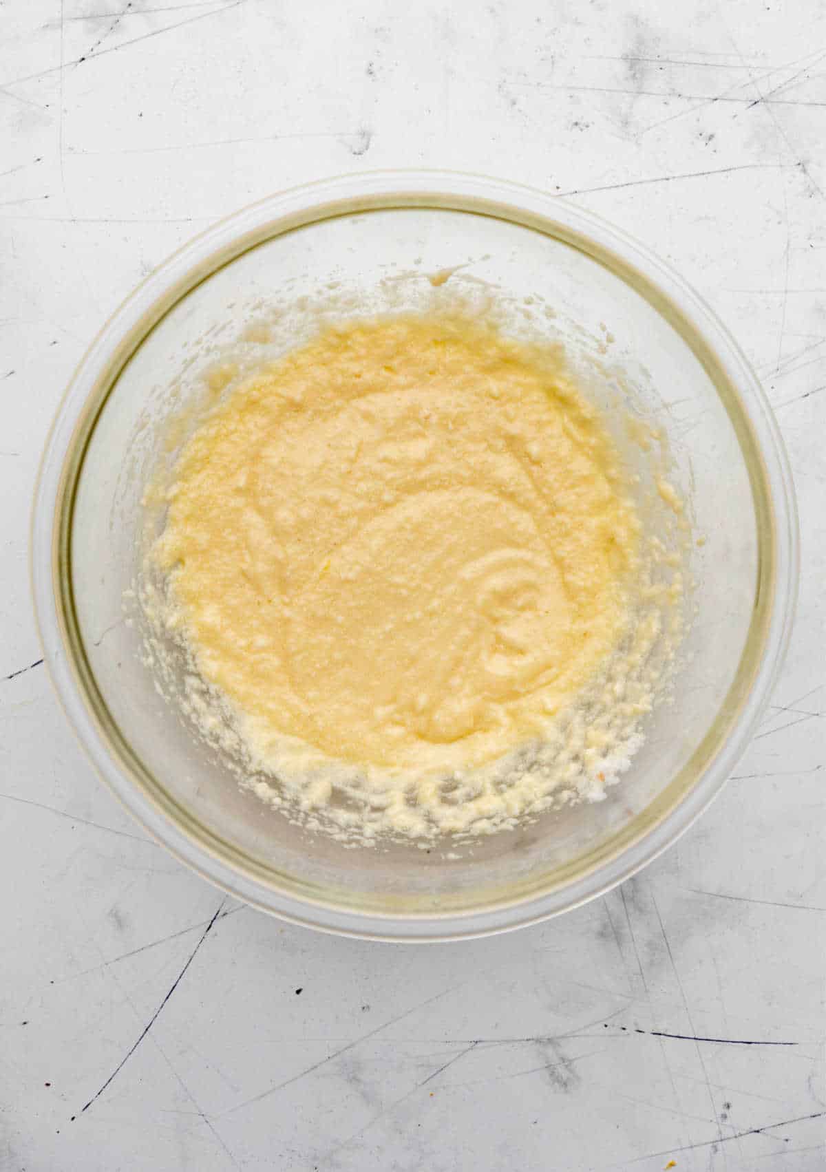 Wet ingredients mixed into creamed butter mixture.
