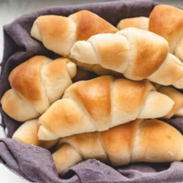 A basket full of crescent rolls.