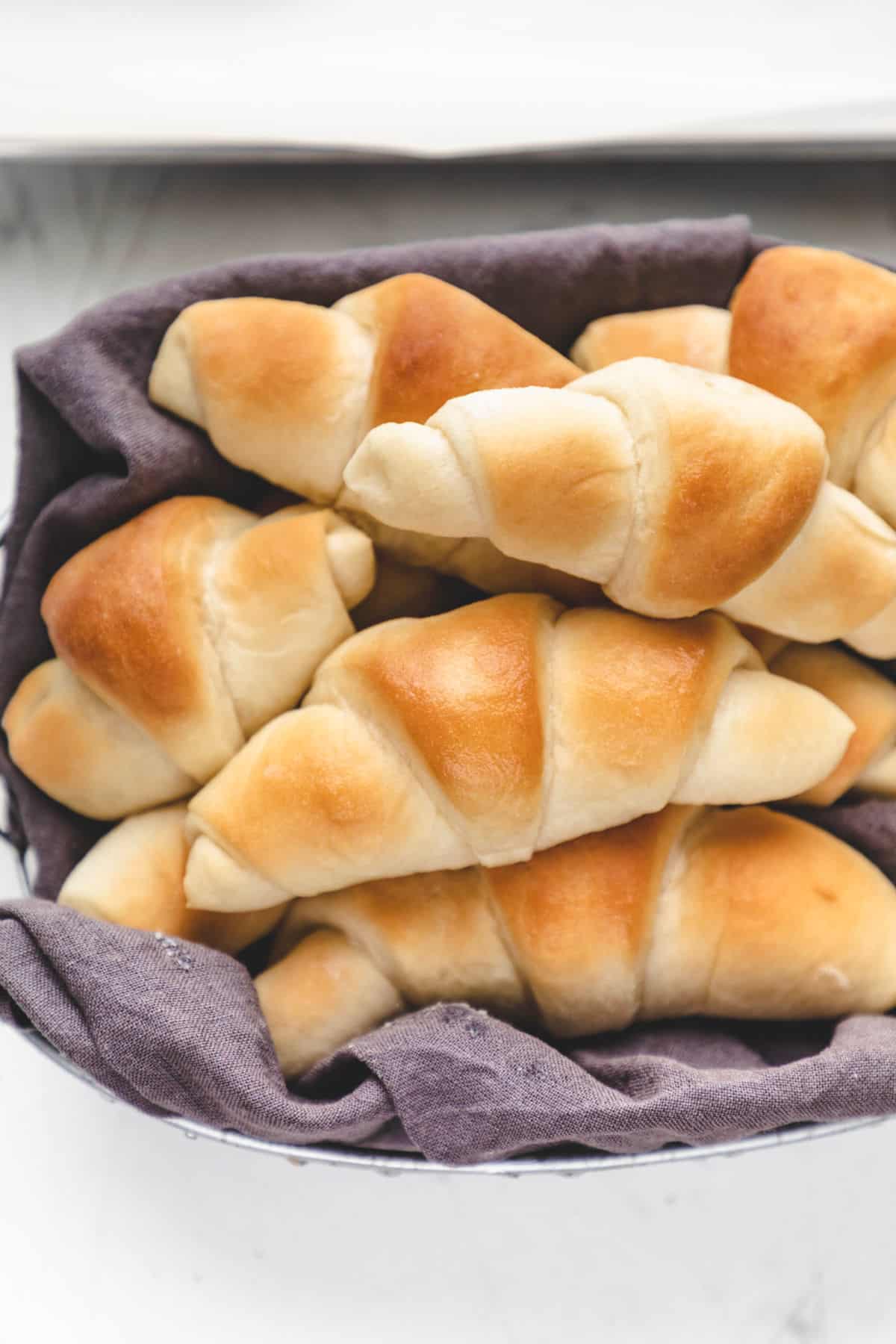 A basket full of crescent rolls.