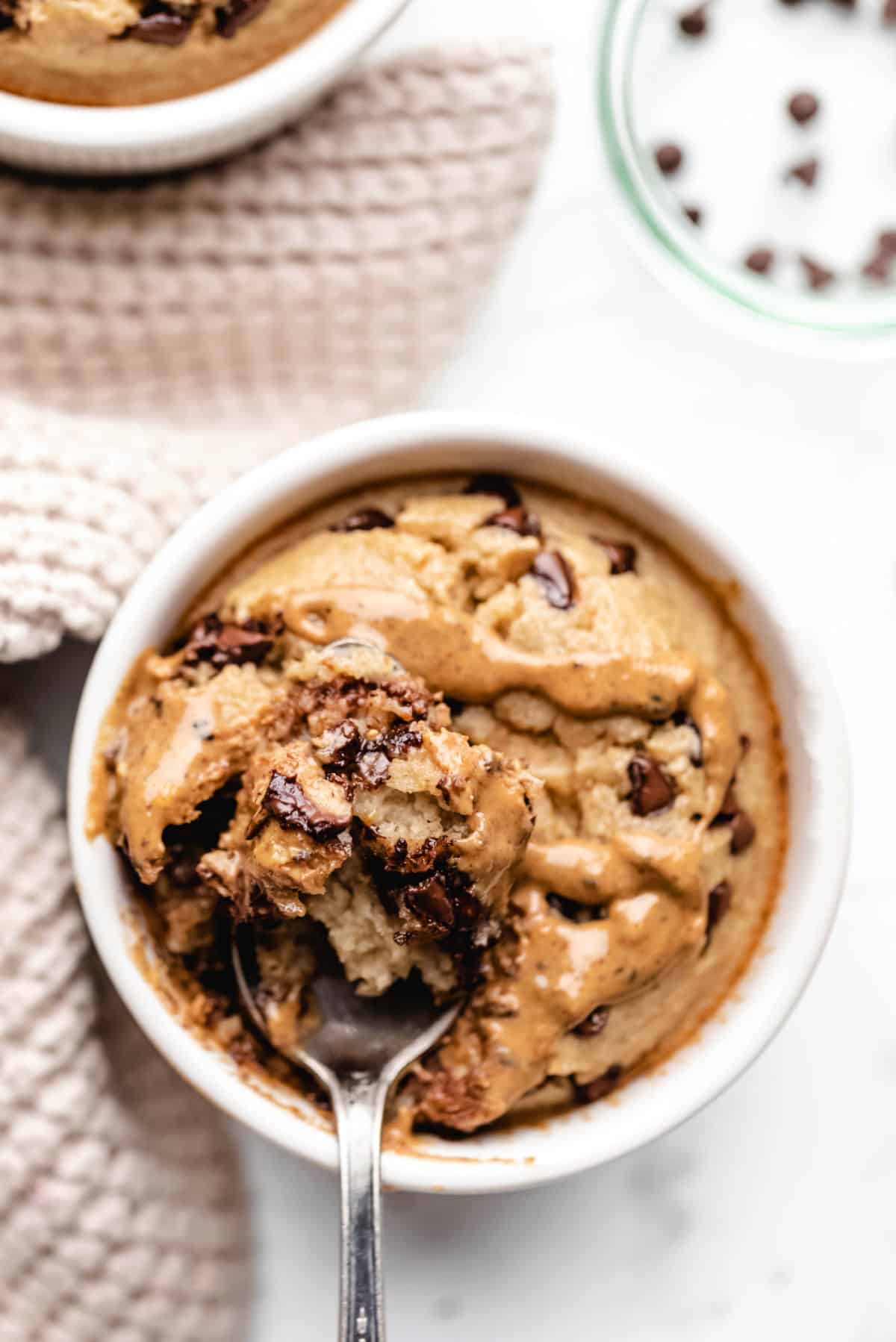 A spoon holding a bite of blended baked oats.