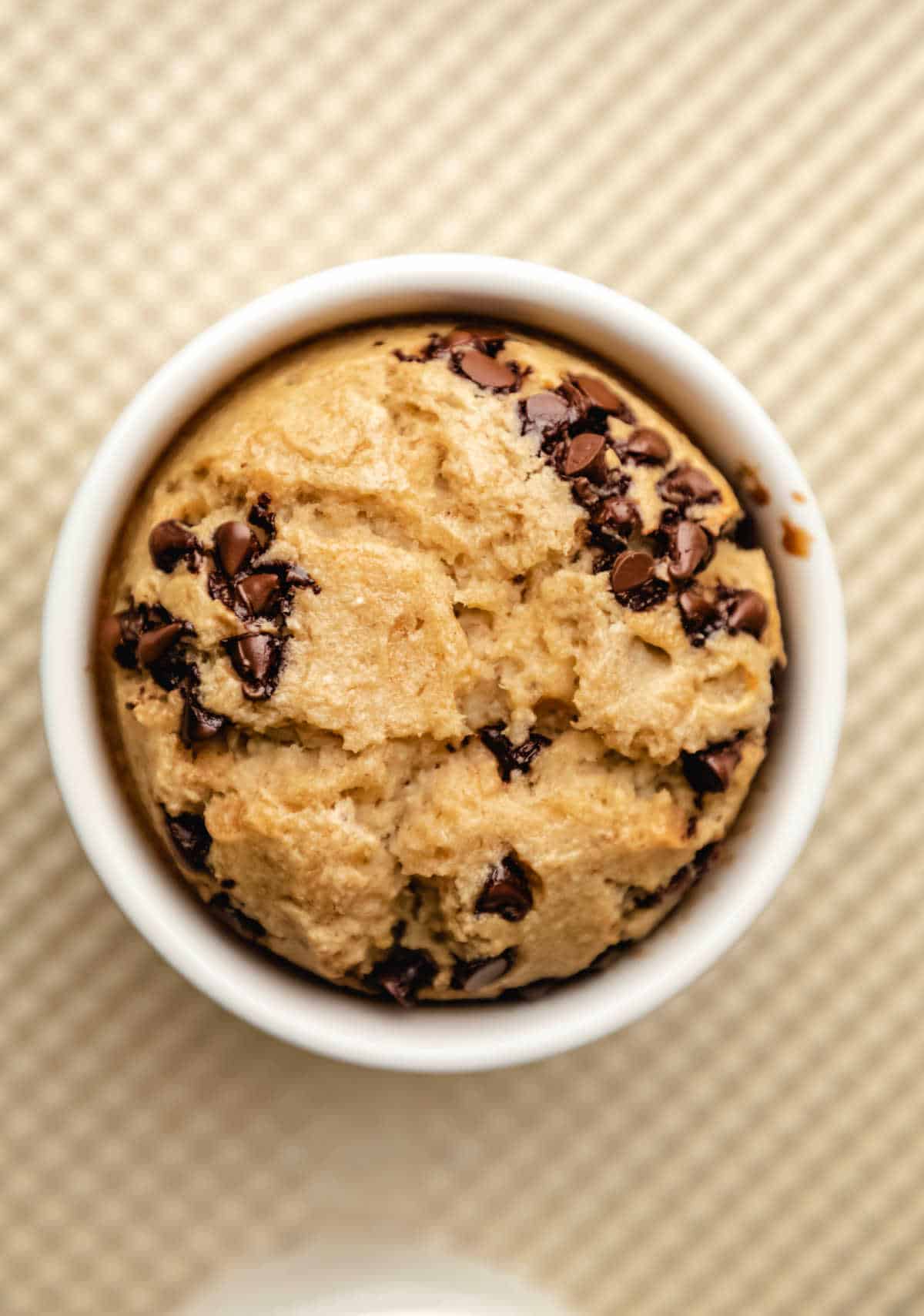 Blended baked oats in a ramekin on a baking sheet. 