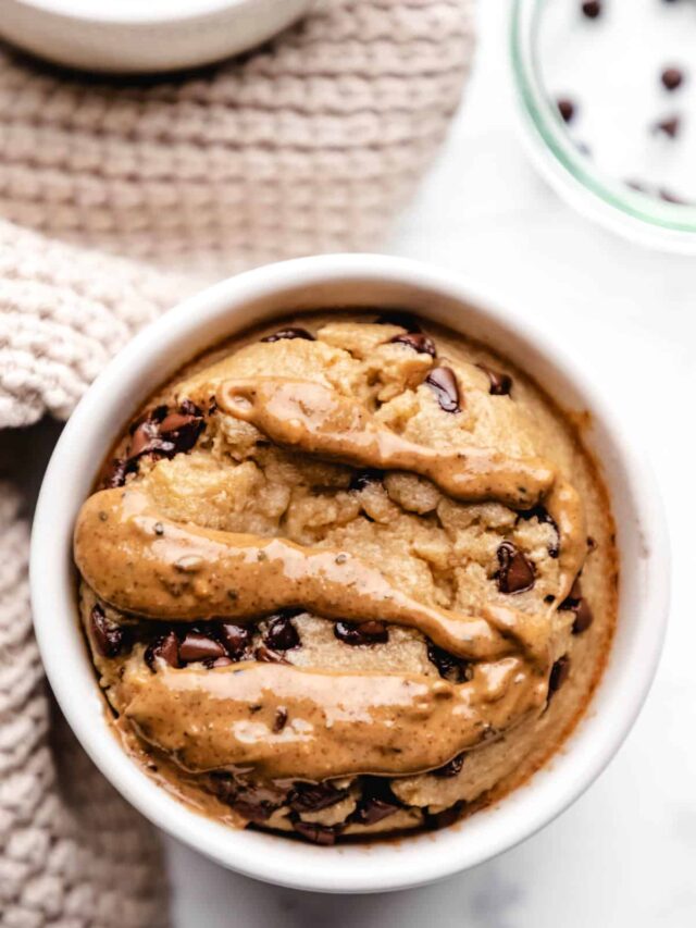 A ramekin with blended baked oats next to a tan knit napkin.