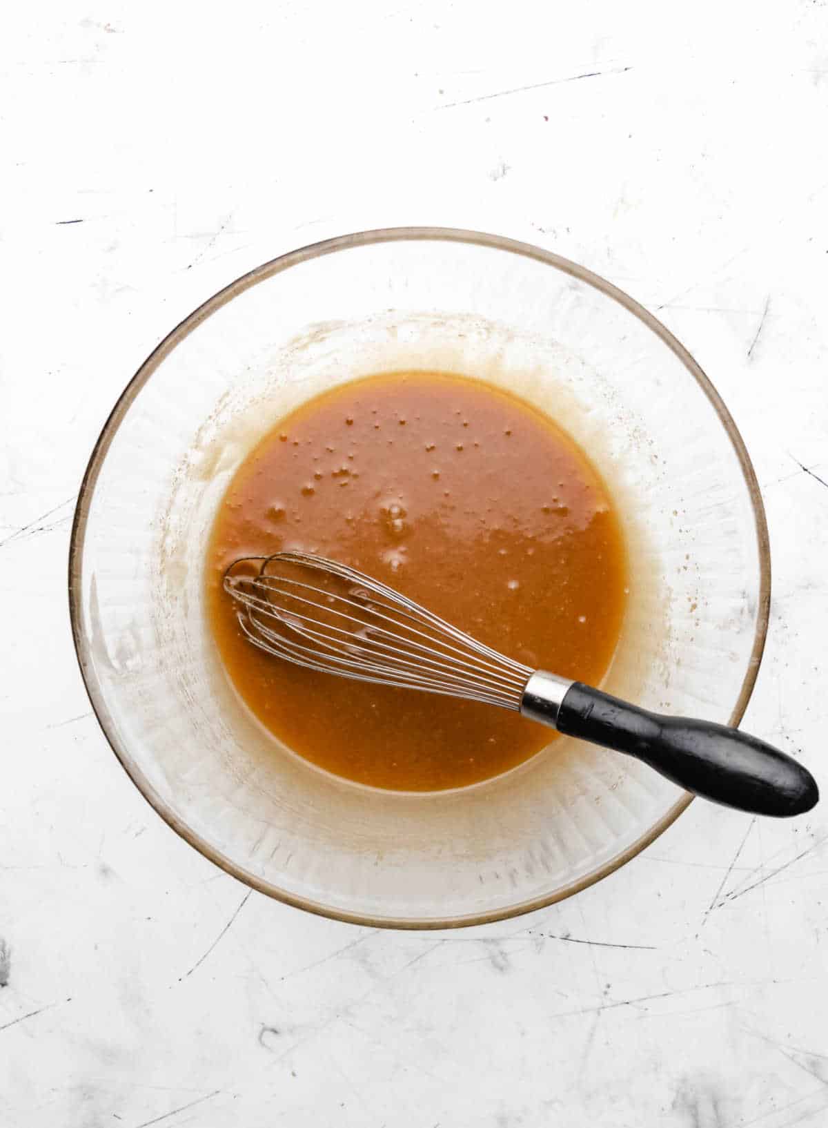 Sugars mixed into melted butter.