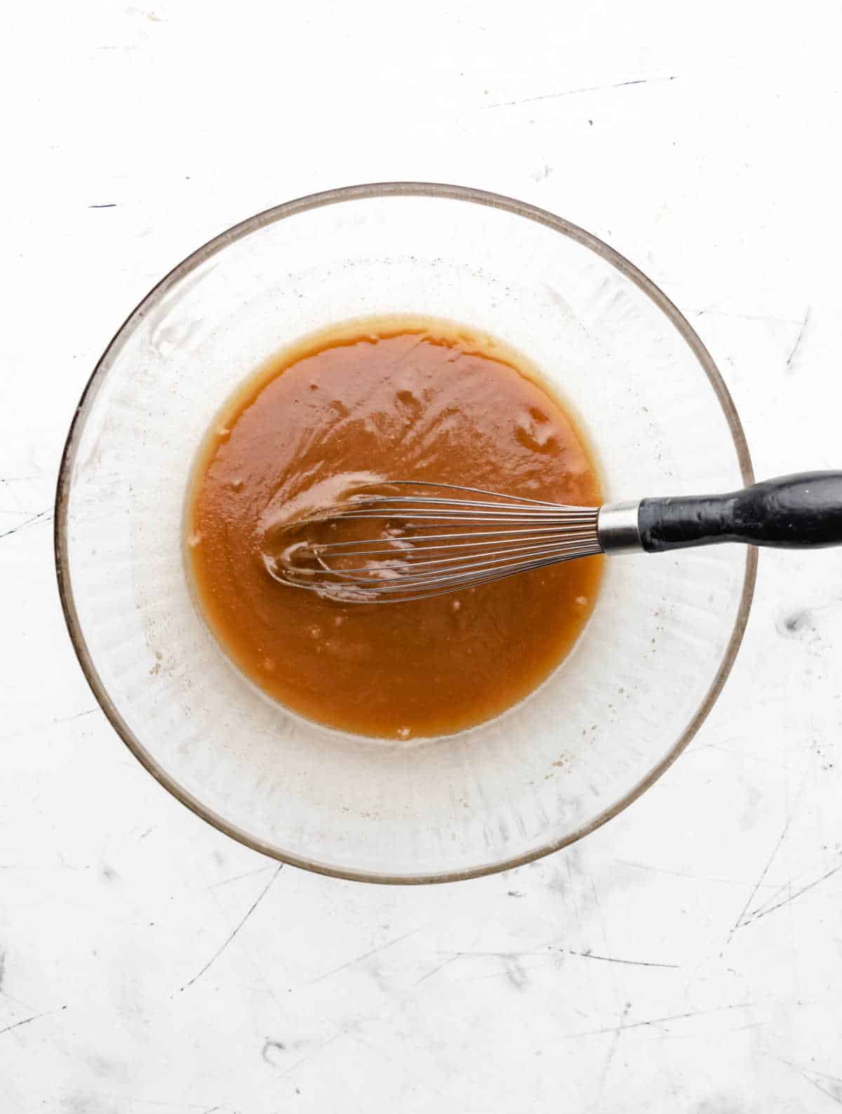 Egg mixed into butter and sugar mixture.
