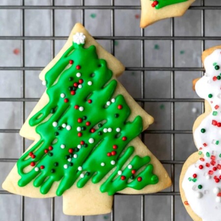 Tree shaped sugar cookie with green icing.