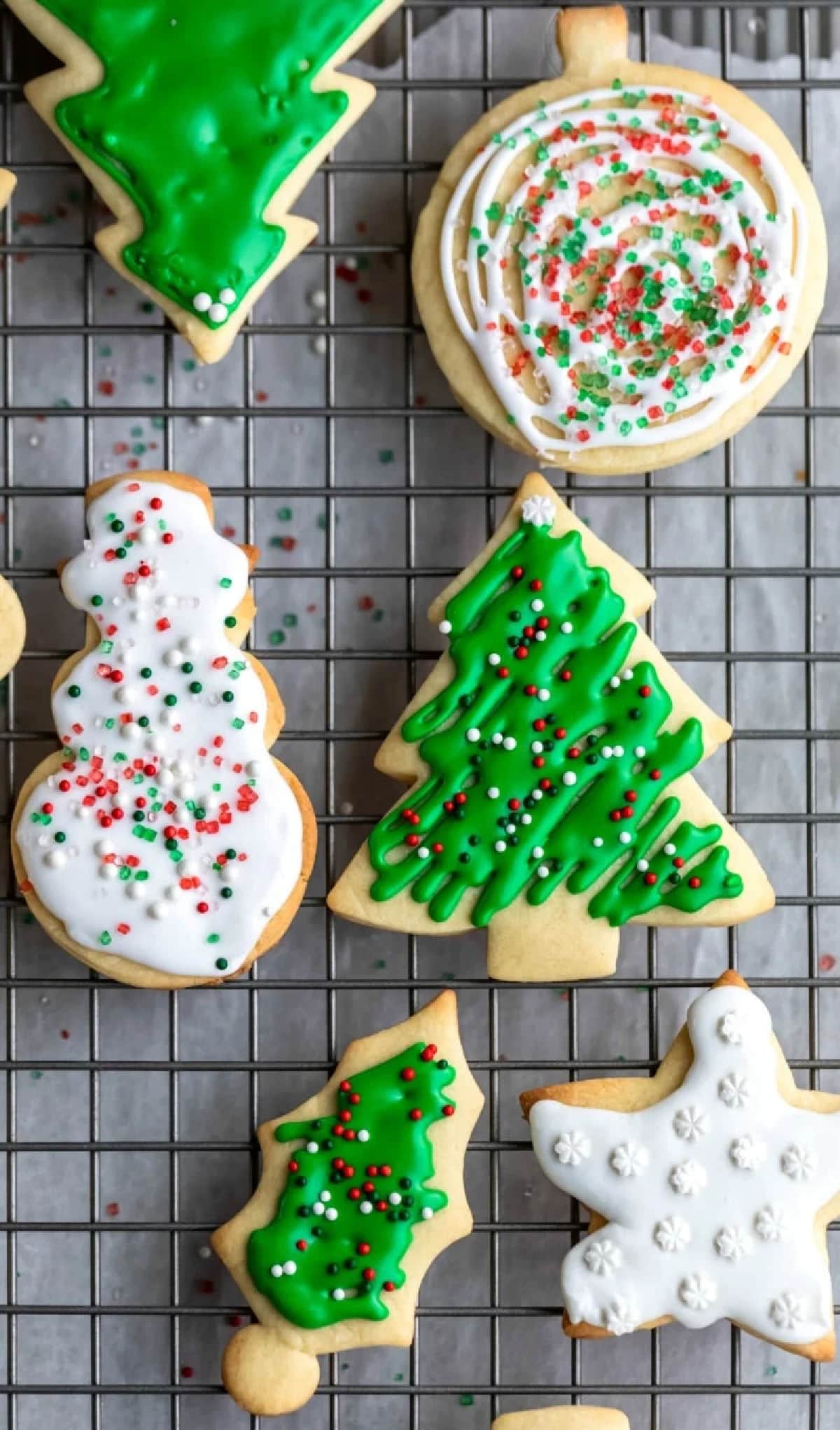 Decorated sugar cookies on a wire cooling rack. 