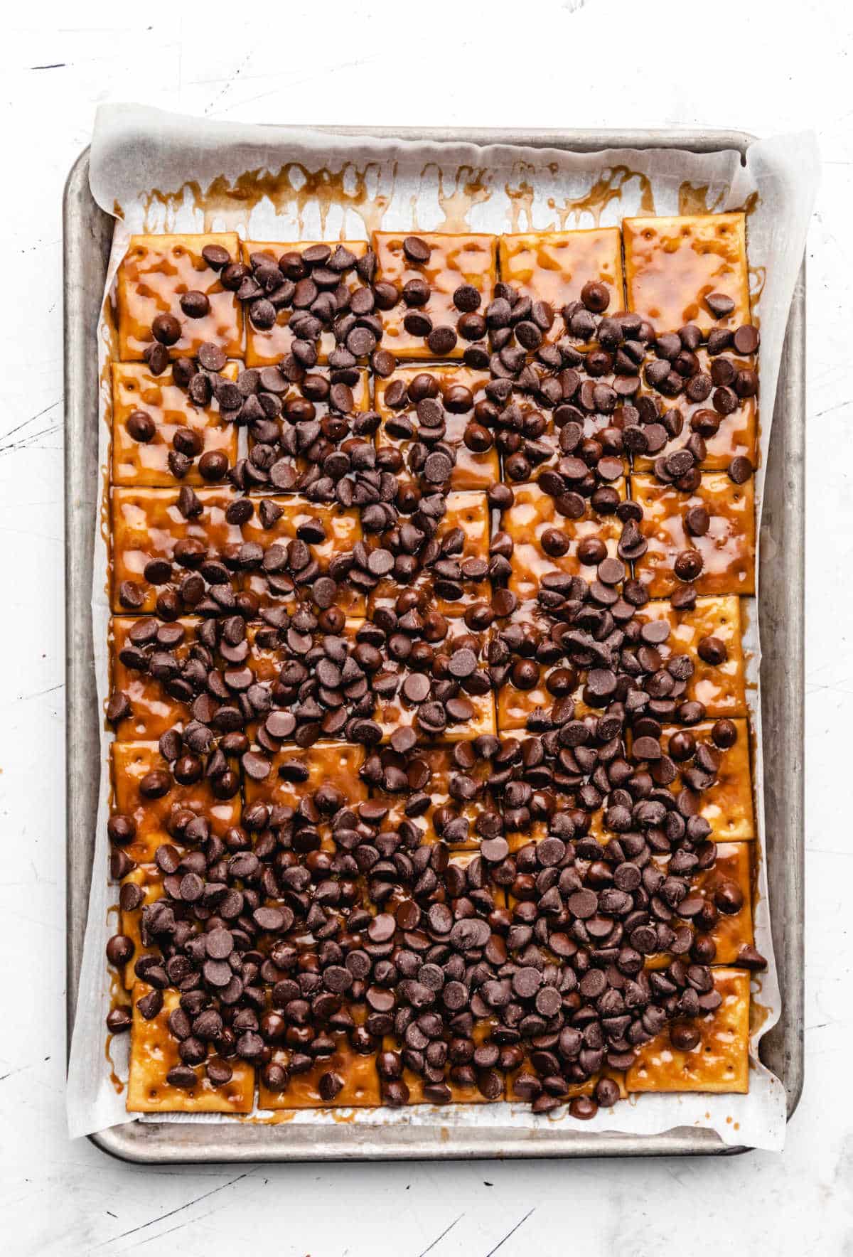 Chocolate chips on top of hot saltine toffee. 