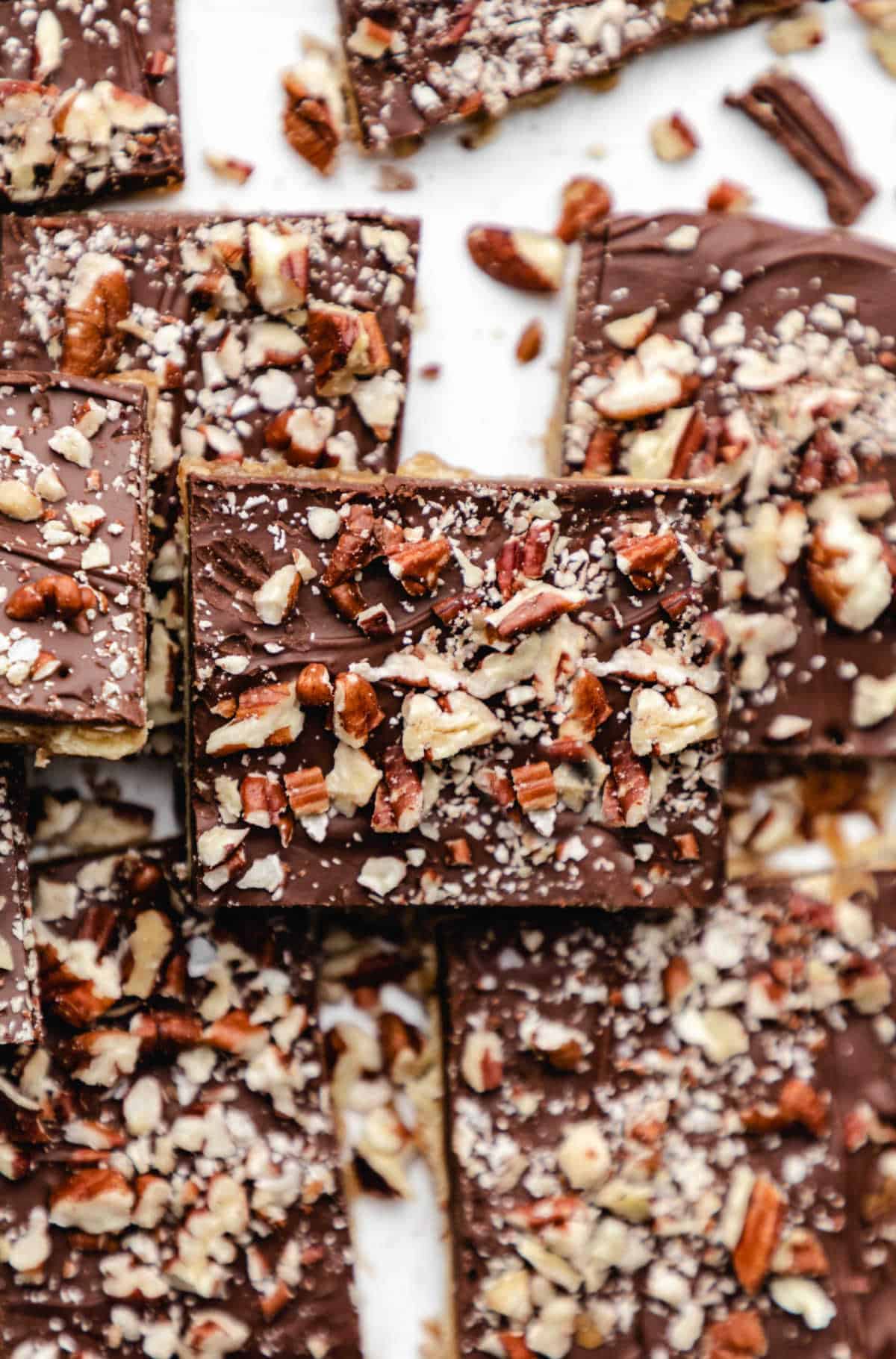 Saltine Toffee A piece of saltine toffee stacked on top of other pieces of toffee.