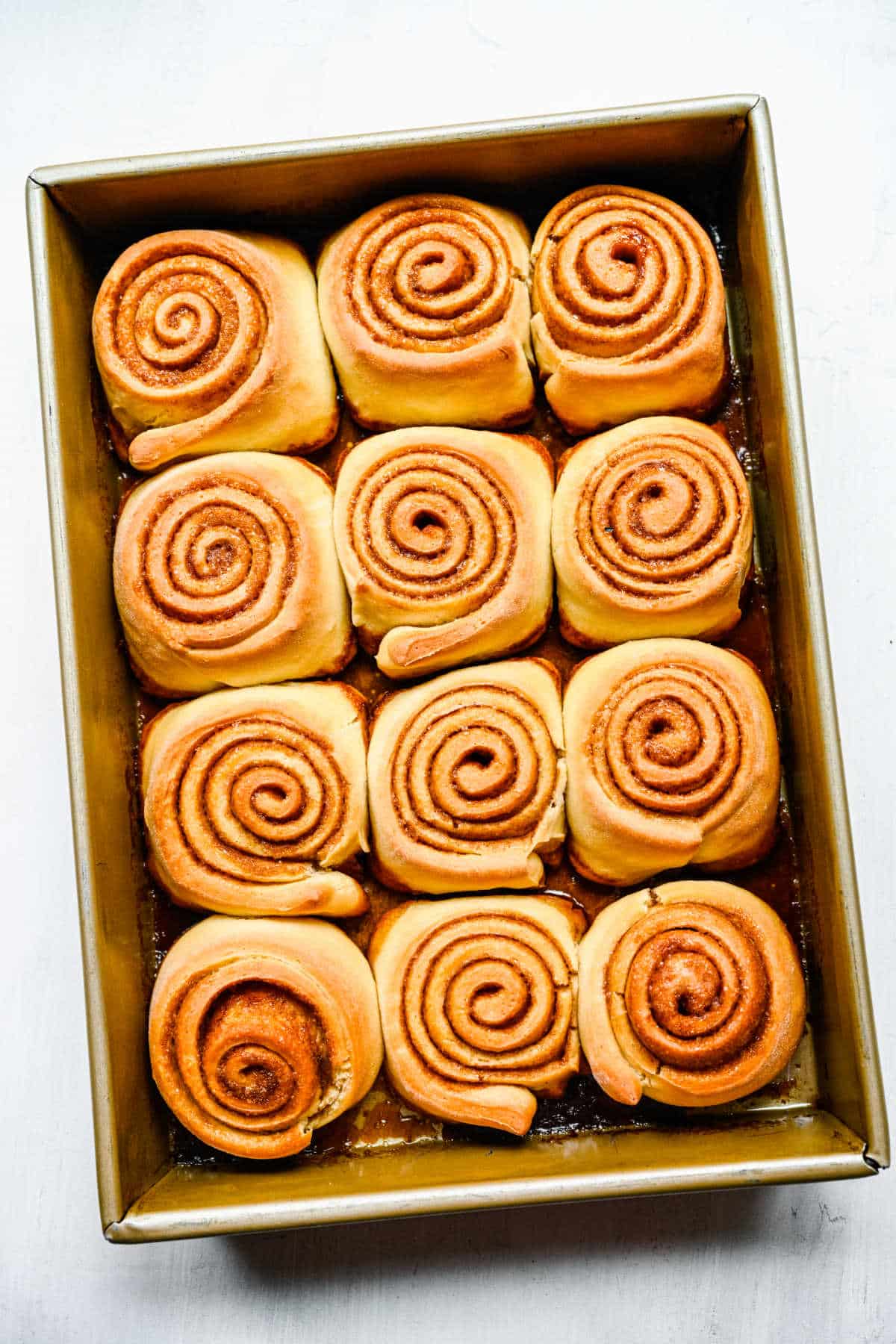 A pan of baked honey buns. 
