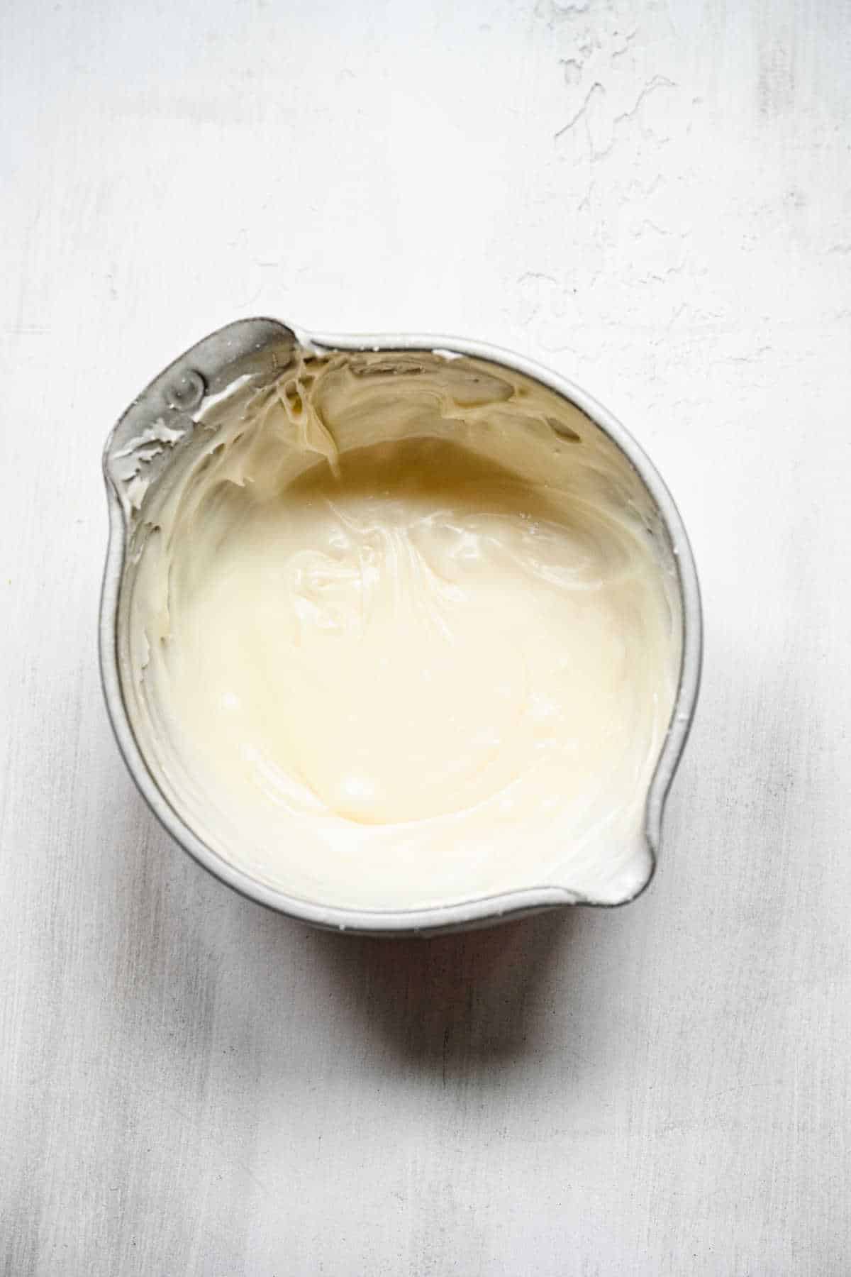 Honey bun icing in a mixing bowl. 