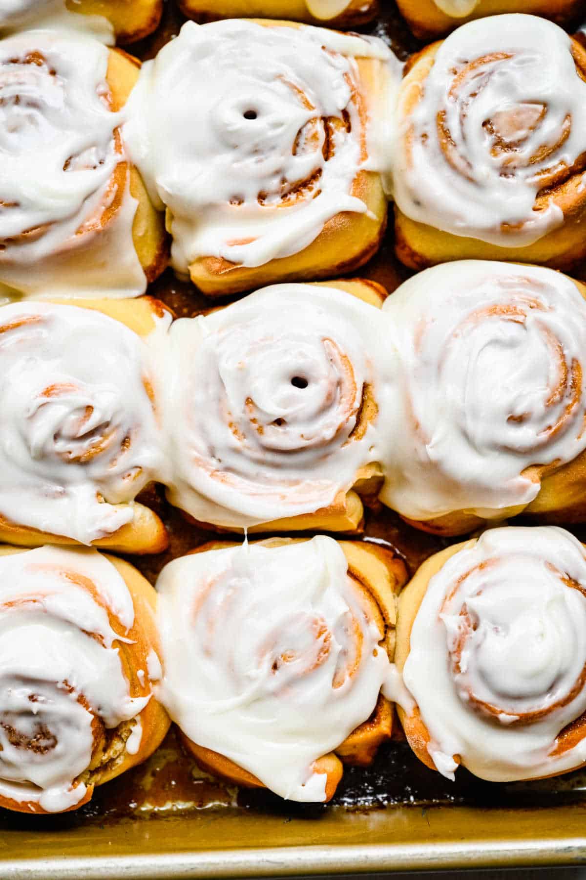 Iced honey buns in a pan. 