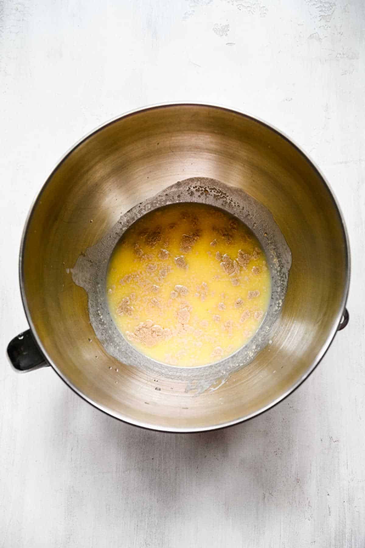 Yeast and honey mixture in a mixing bowl. 