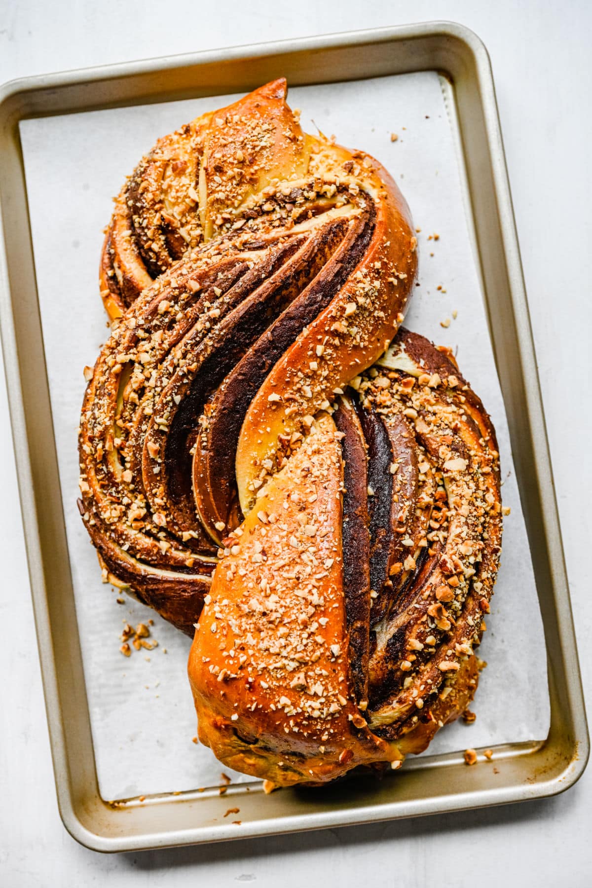 Nutella bread on a parchment paper-lined baking sheet.