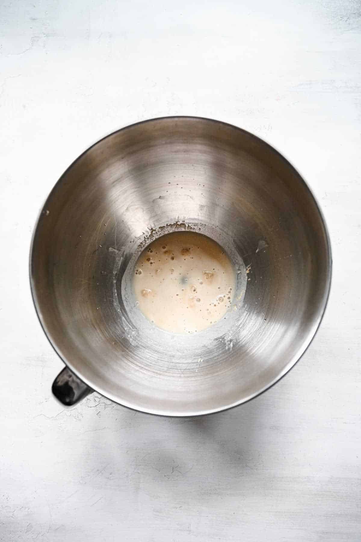 Yeast sugar and water proofing in a mixing bowl. 