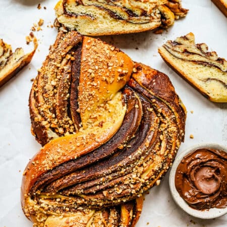 A loaf of Nutella bread with a couple slices cut.