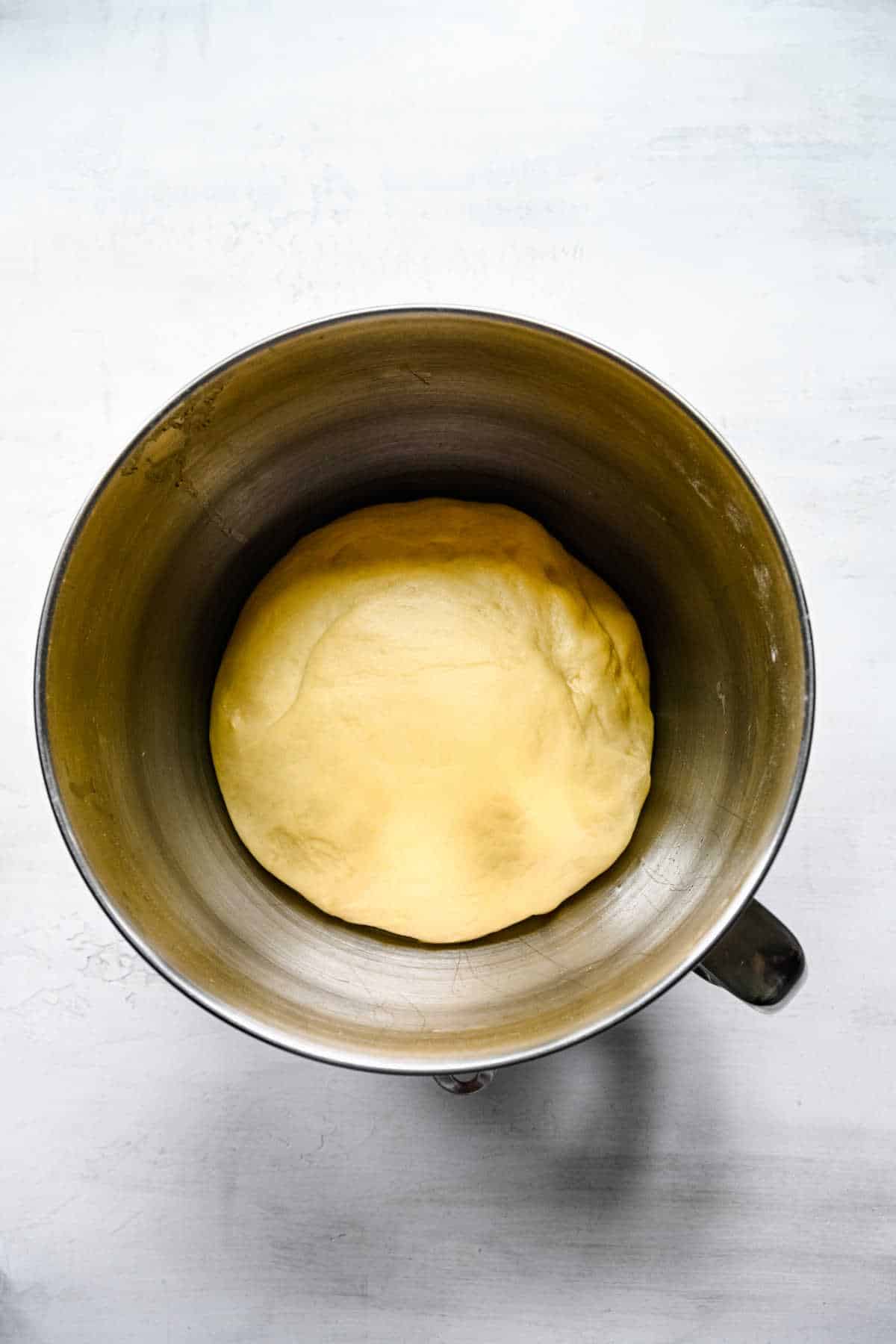 Risen dough in a mixing bowl. 