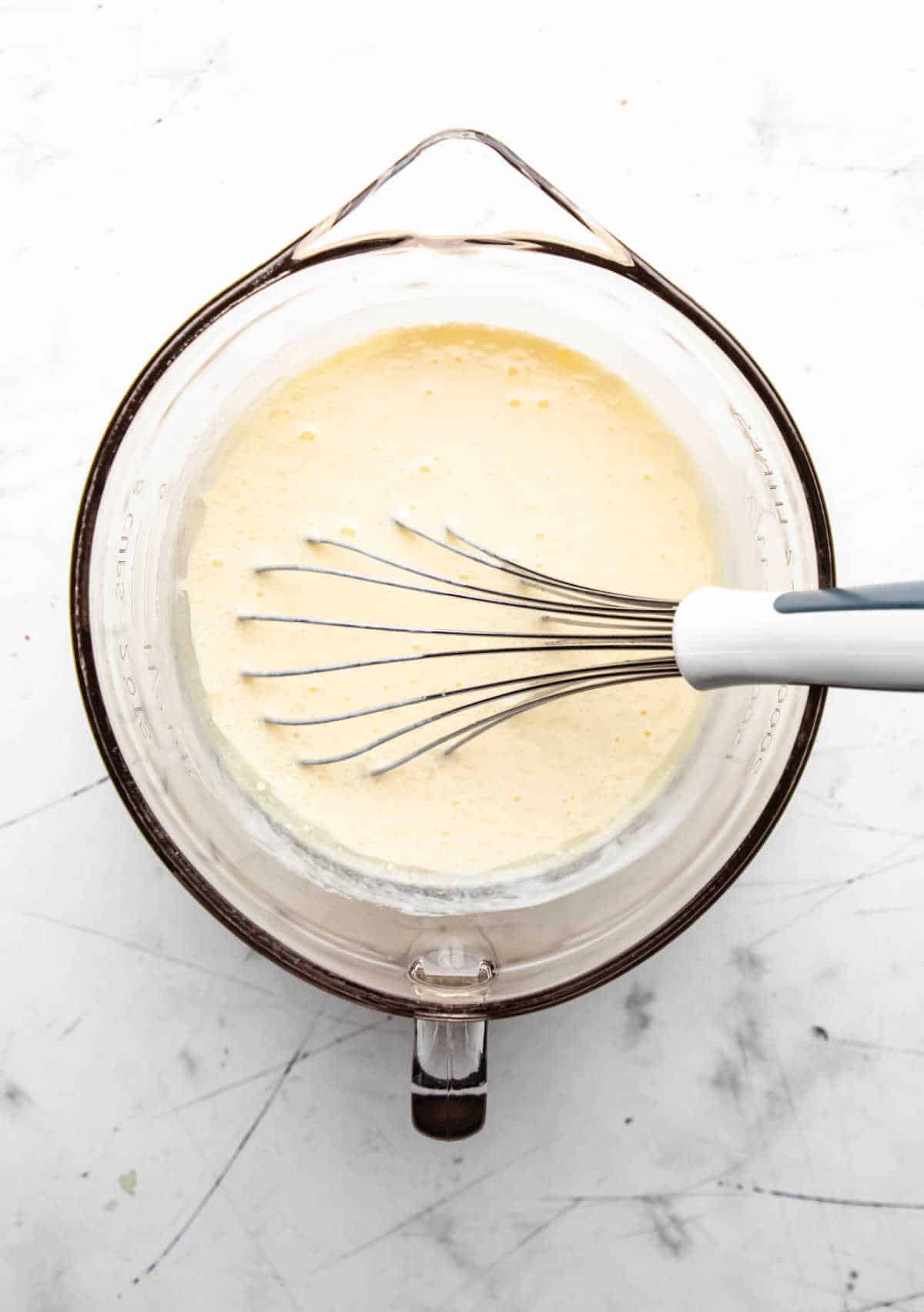 Oil and vanilla extract mixed into buttermilk and eggs.