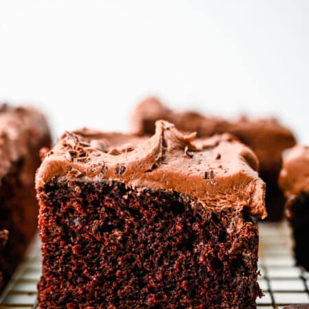 Slices of wacky cake on a wire cooling rack.