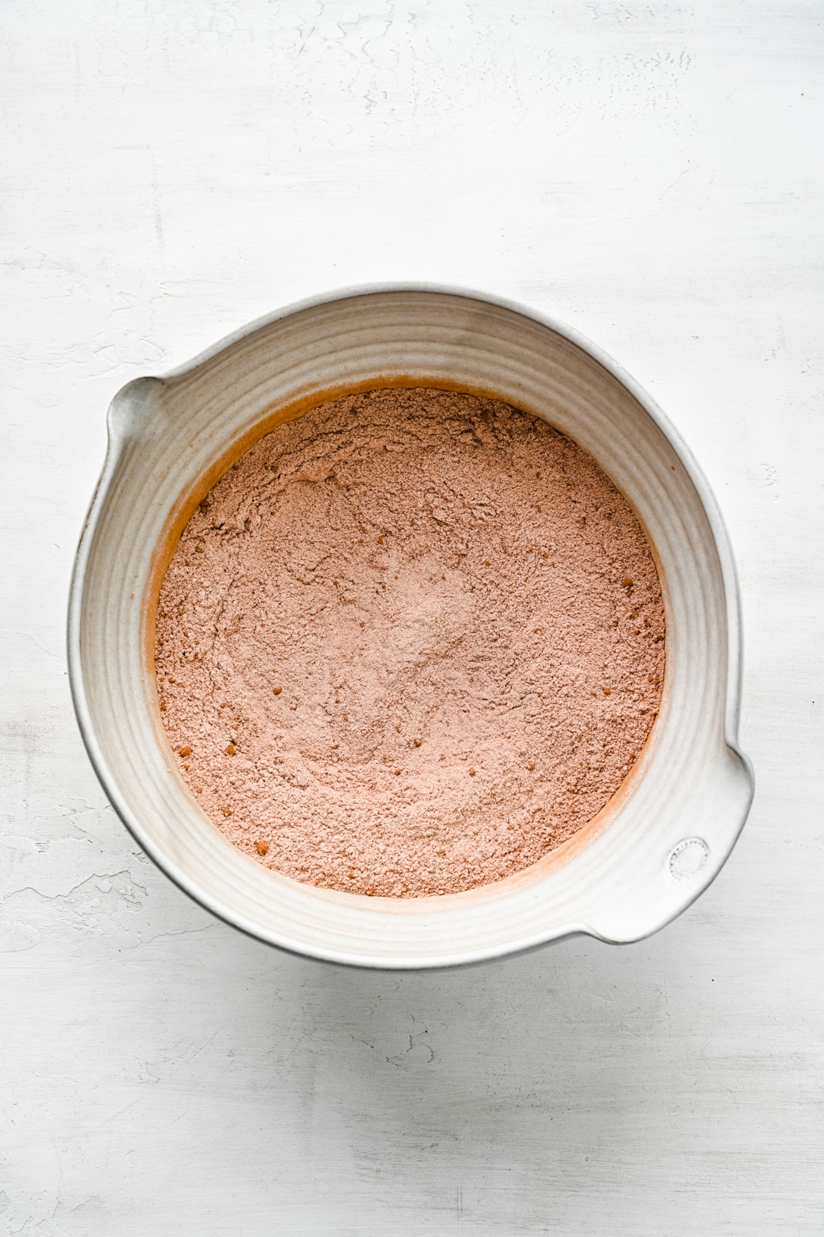 Dry ingredients for wacky cake in a mixing bowl. 