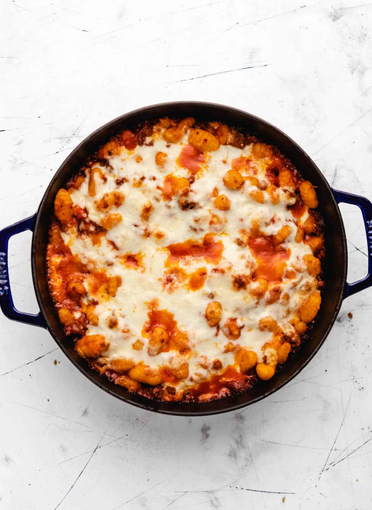 Baked gnocchi in a skillet.