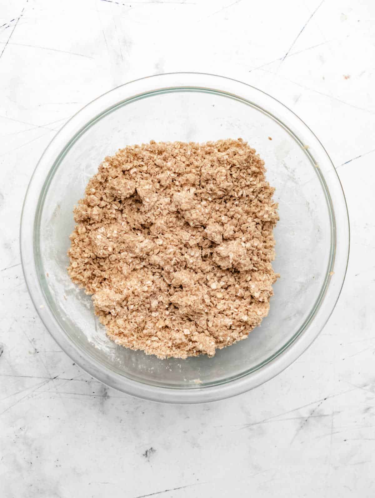 Crumb topping in a glass mixing bowl. 