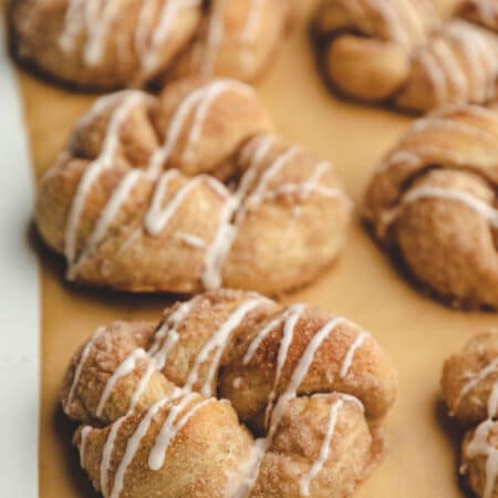 30 Minute cinnamon sugar knots on a piece of brown parchment paper.