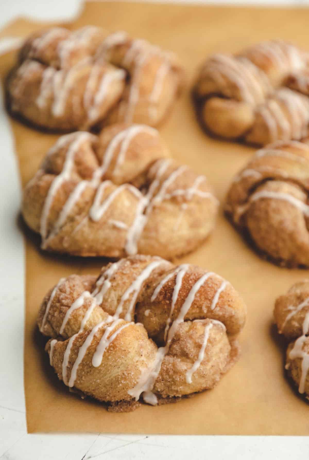 30 Minute cinnamon sugar knots on a piece of brown parchment paper.