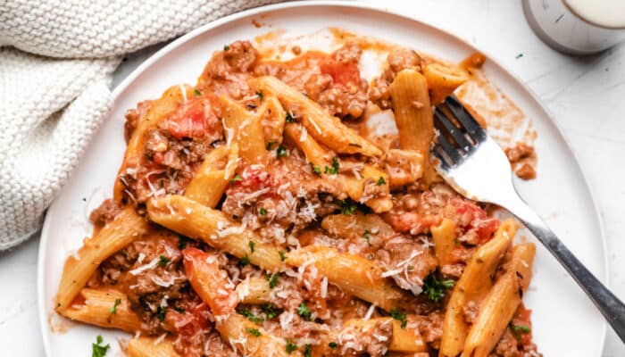 White plate with Instant Pot ground beef pasta on it.