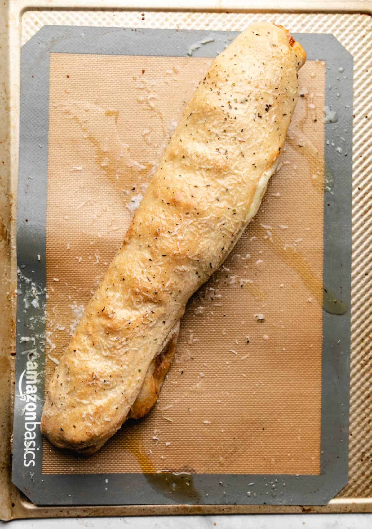 Baked pizza bread brushed with garlic butter. 
