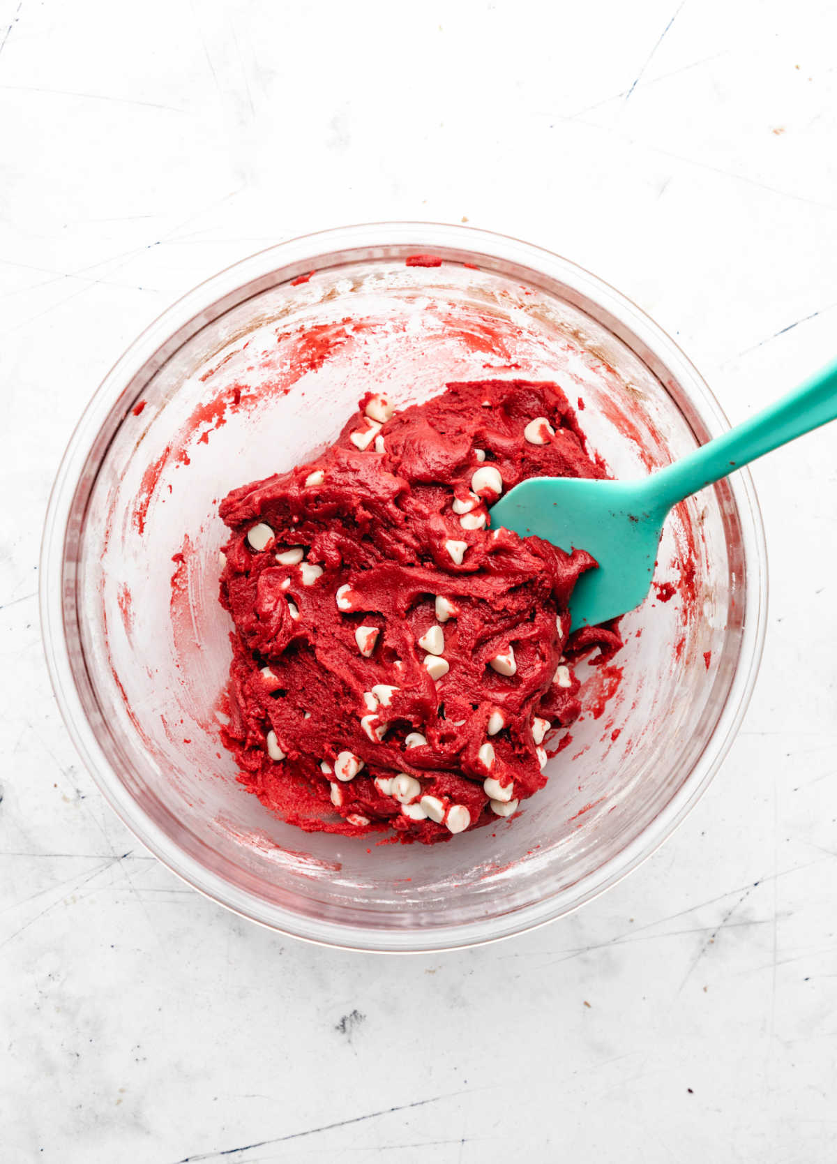 Red velvet cookie dough with white chocolate chips in it. 