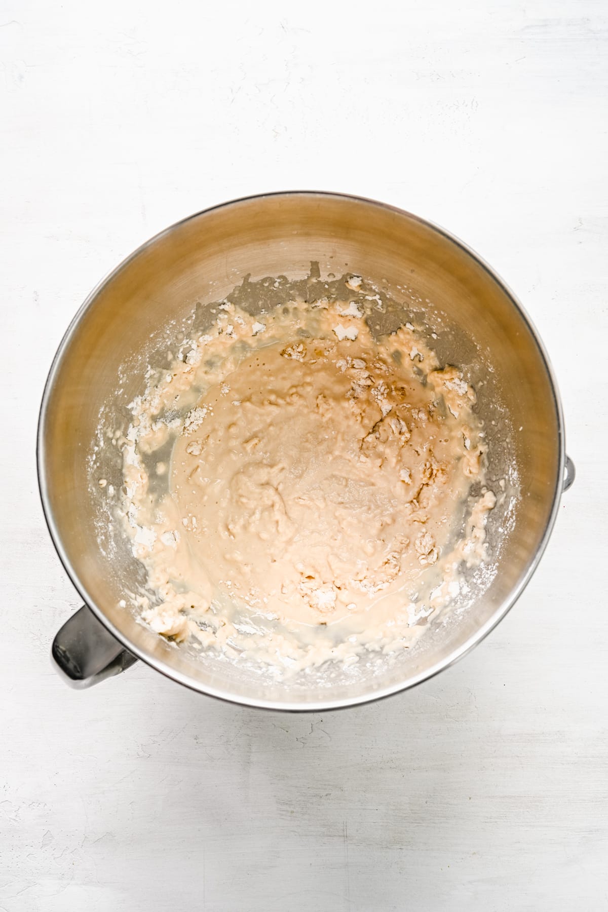 Two cups of flour mixed into yeast mixture. 