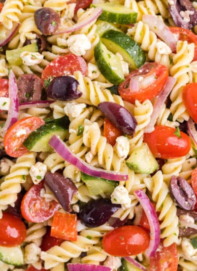 Close up photo of Greek pasta salad.