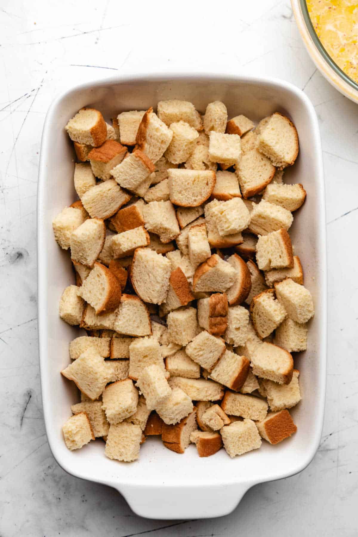 Bread cubes in a baking pan. 