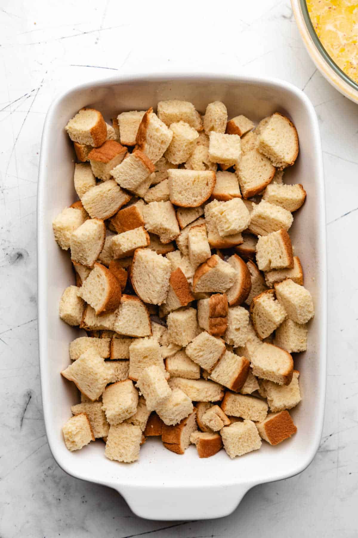 Bread cubes in a baking pan.