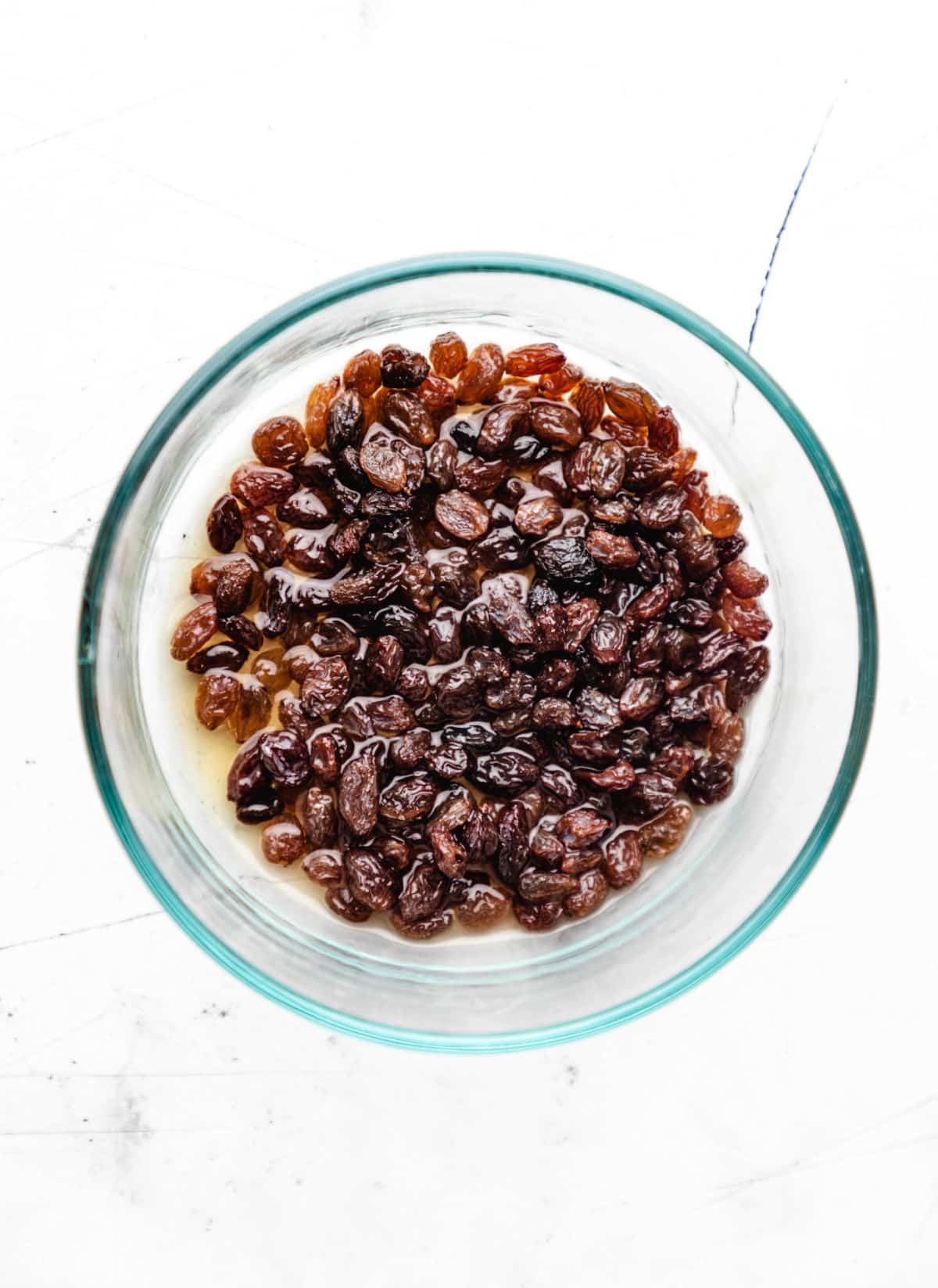 Raisins in whiskey in a bowl. 