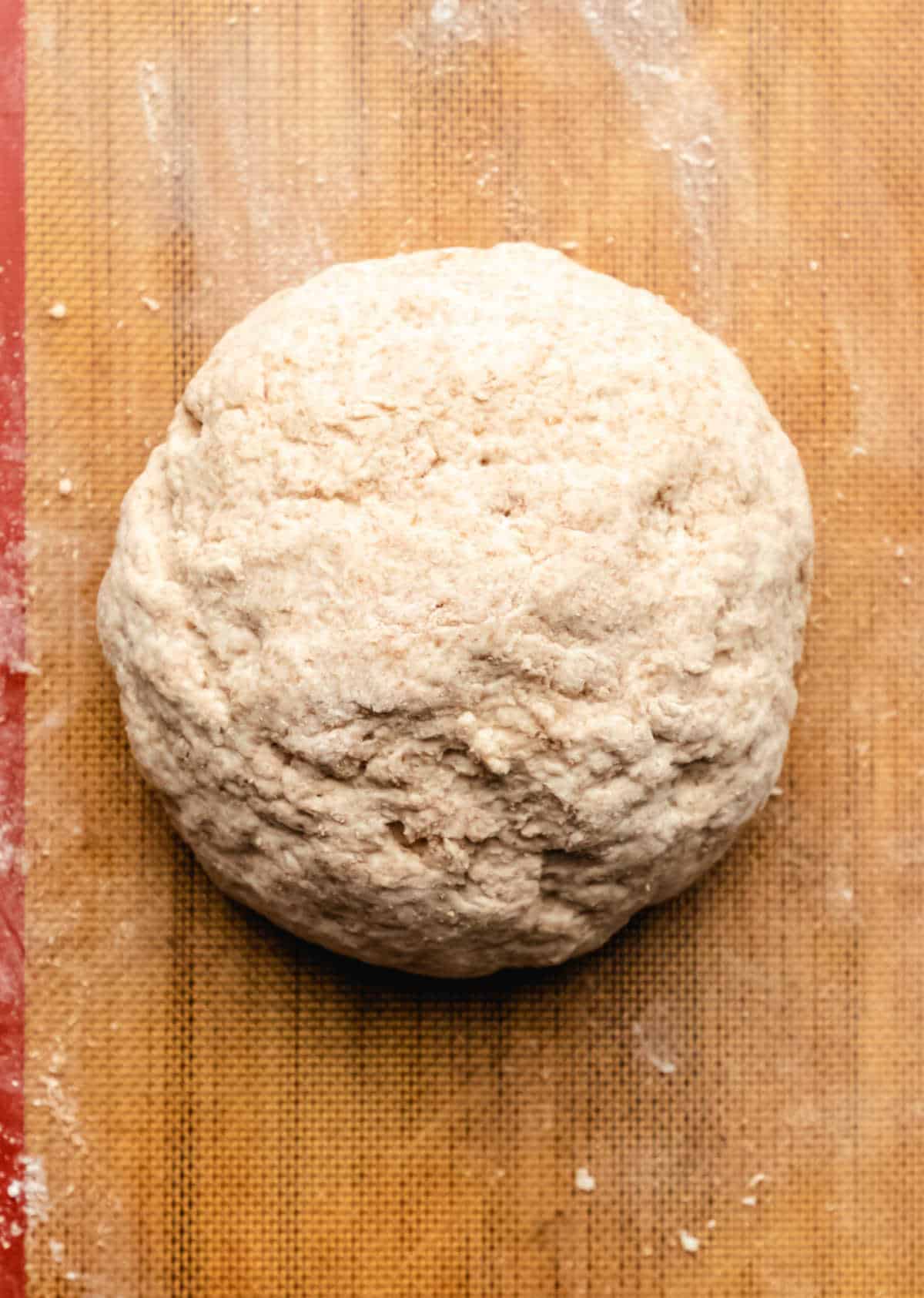 Irish brown soda bread dough shaped into a ball. 
