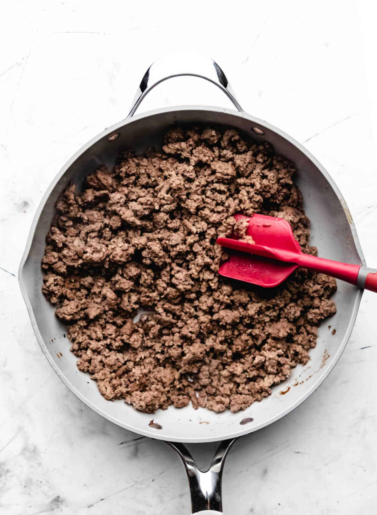 Browned ground beef in a skillet. 