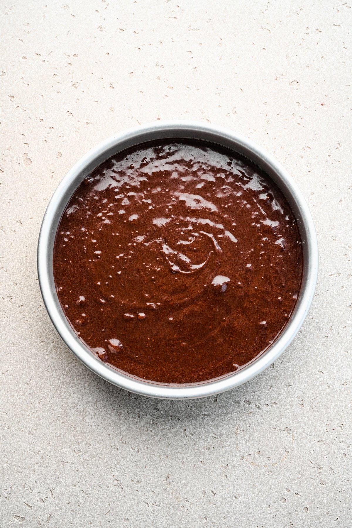 Chocolate cake batter in a pan. 