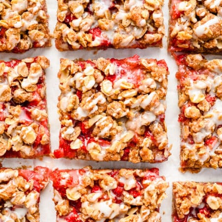 Strawberry oatmeal bars cut into pieces in rows.
