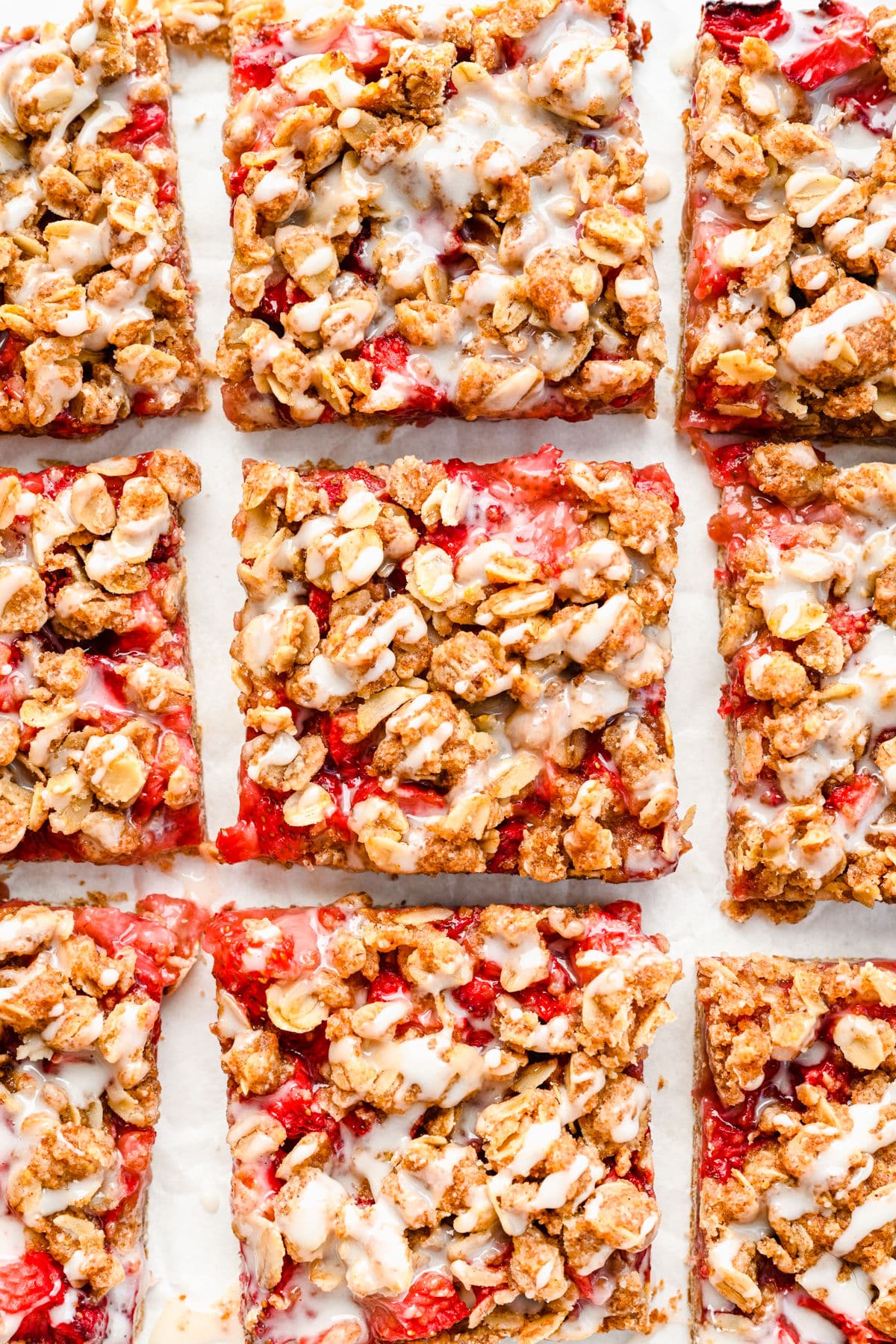 Strawberry oatmeal bars cut into pieces in rows. 