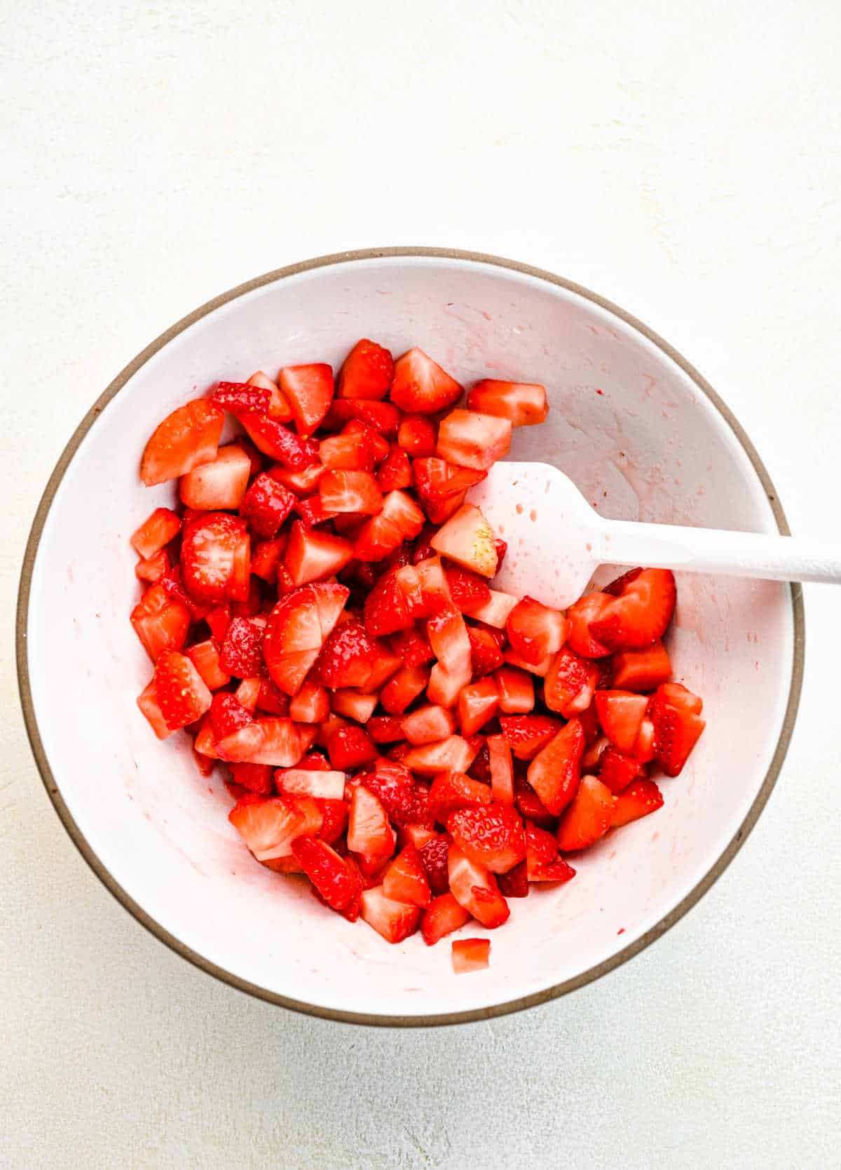 Strawberry mixture in a mixing bowl. 