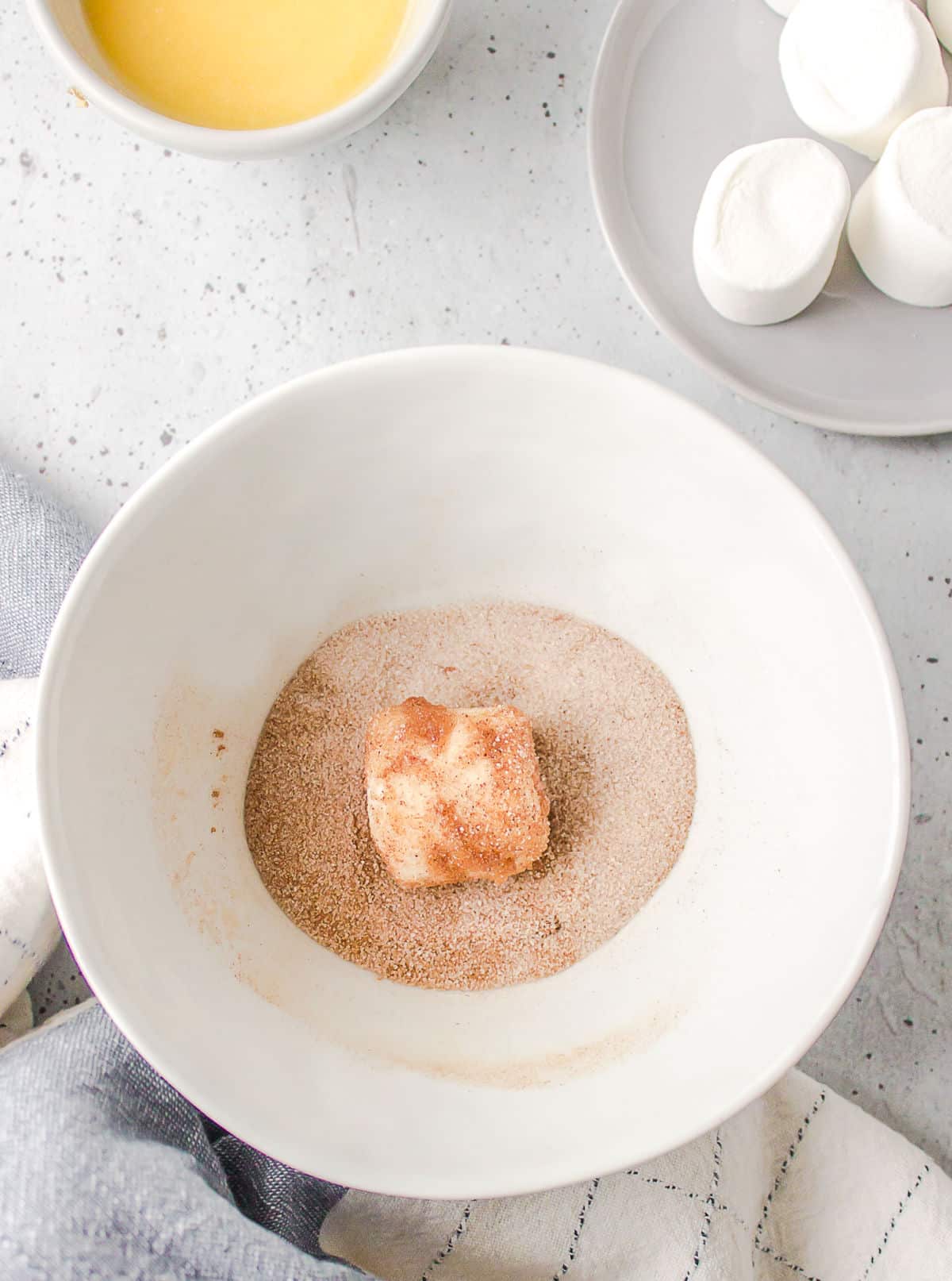 Marshmallow in cinnamon sugar mixture. 