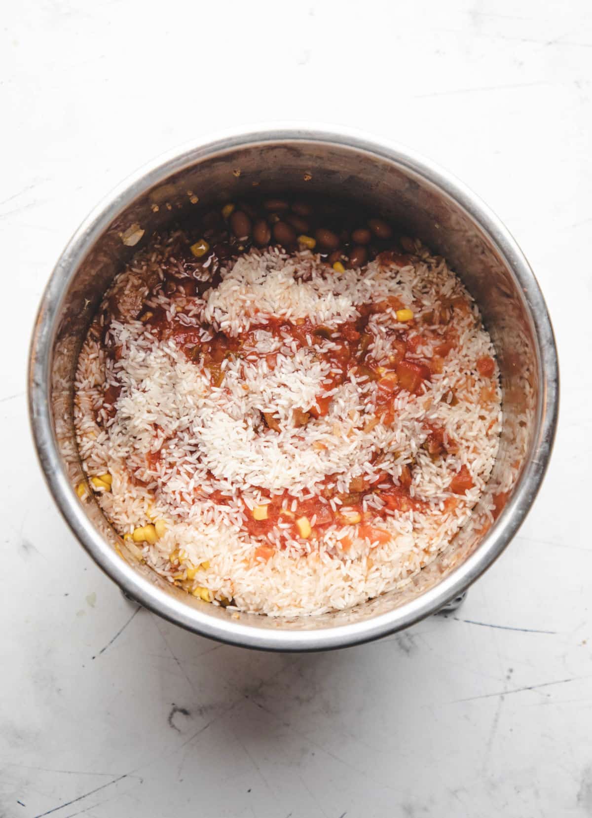 Ingredients for instant pot burrito bowls in an instant pot.