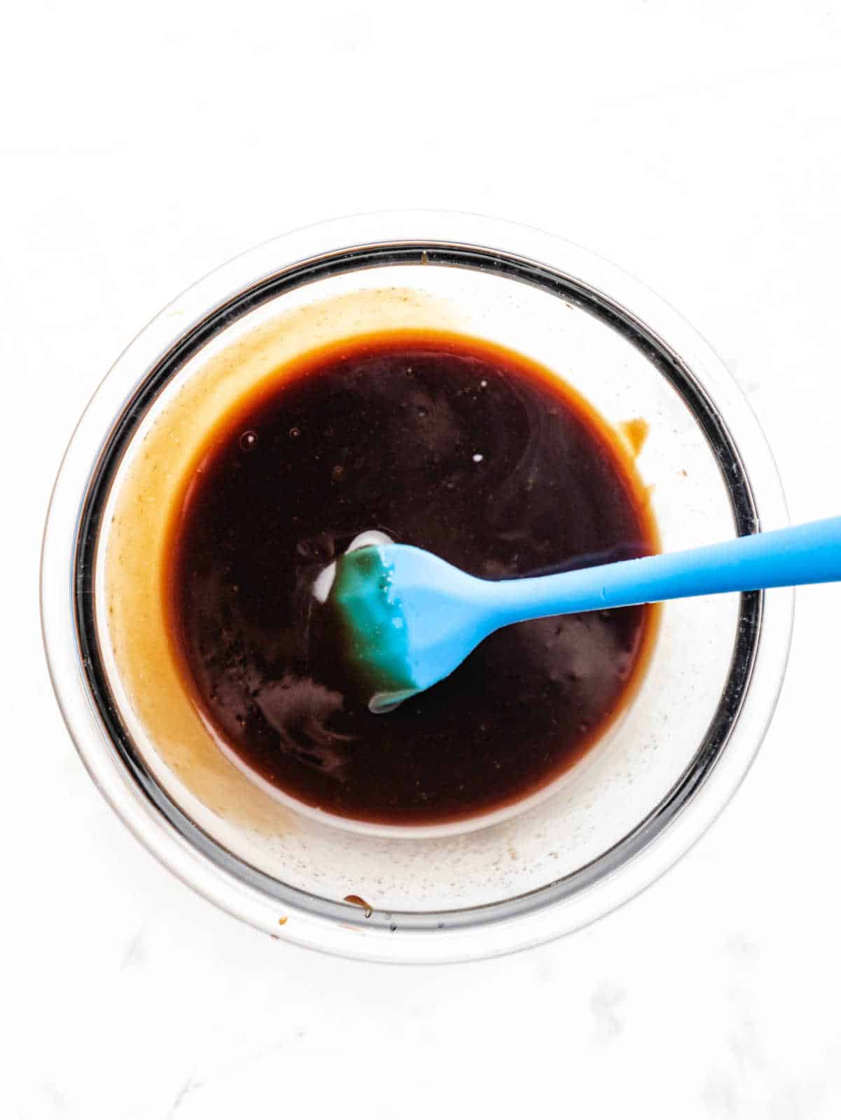 Hoisin mixture in a glass mixing bowl.