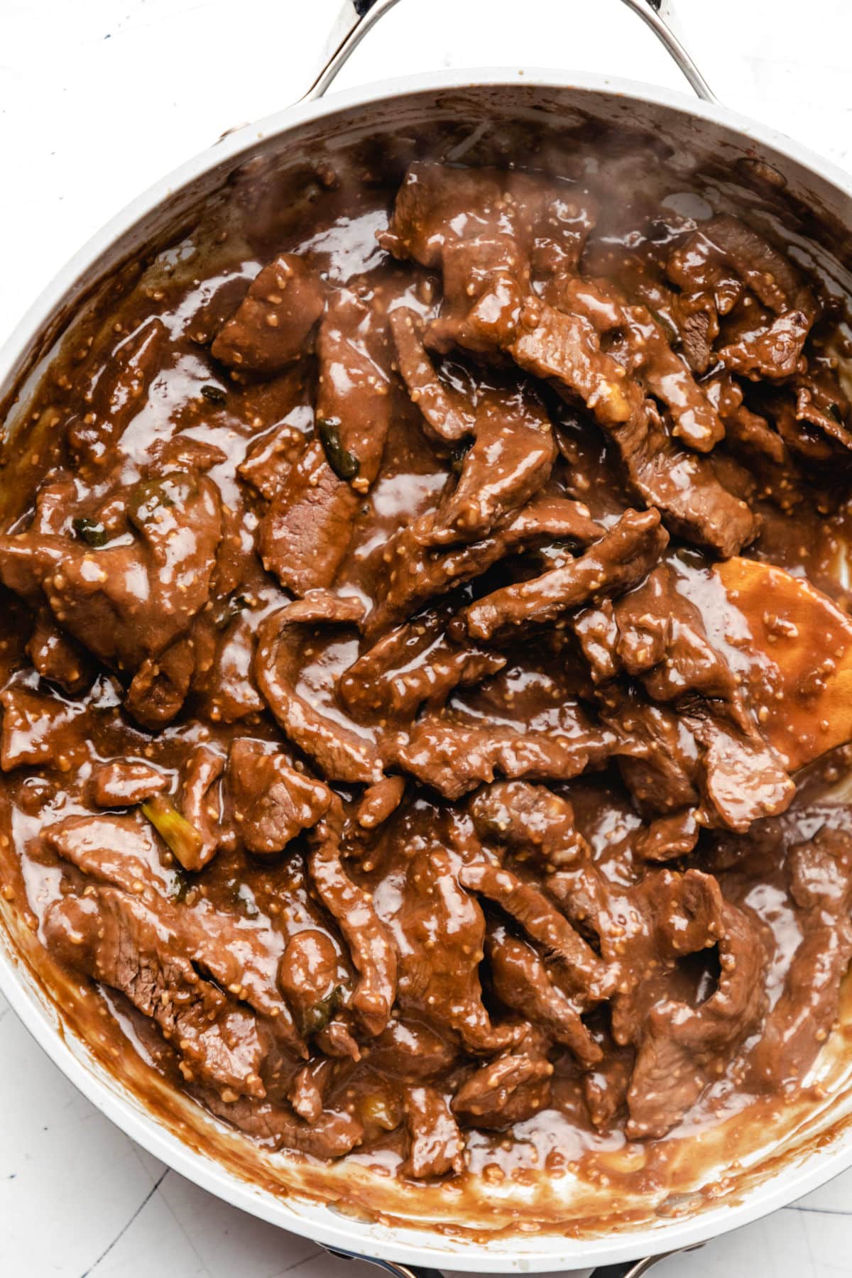 Close up photo of Mongolian beef in a saucepan. 