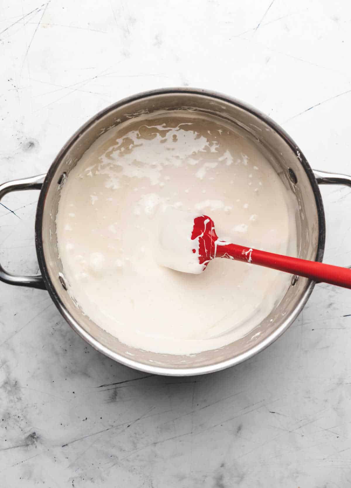 Melted butter and marshmallow mixture in a large pot.