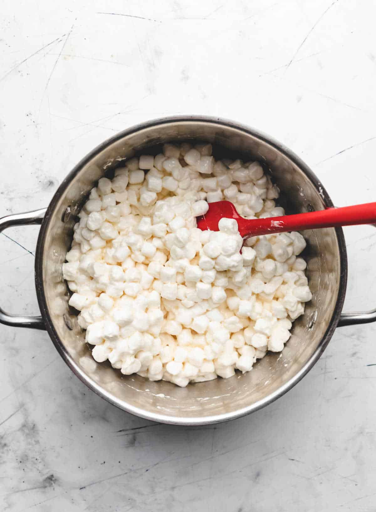 Mini marshmallows in a large pot. 