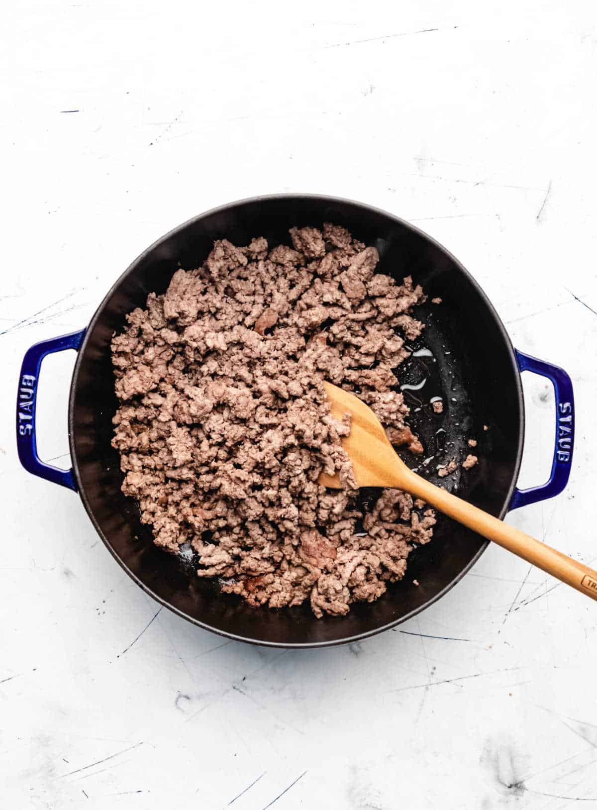 Browned ground beef in a skillet. 