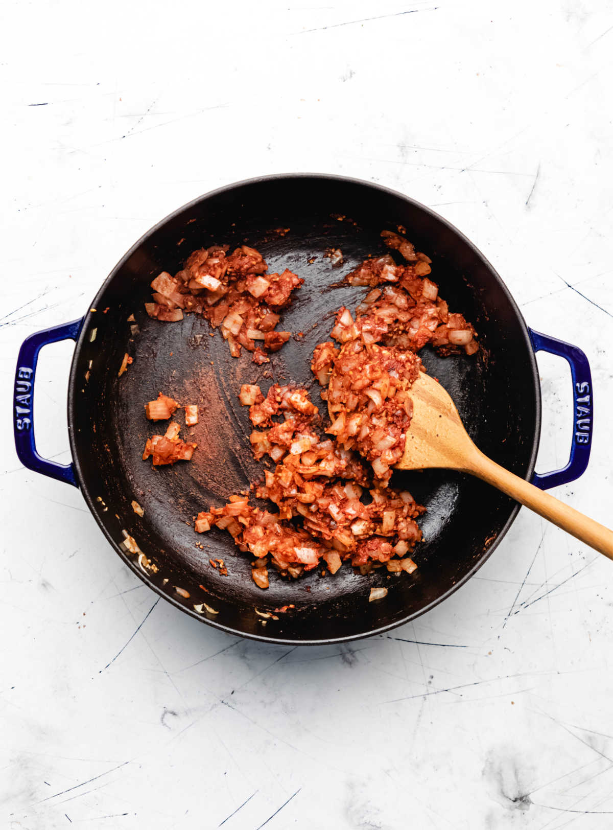 Tomato mixture cooking in a large skillet. 