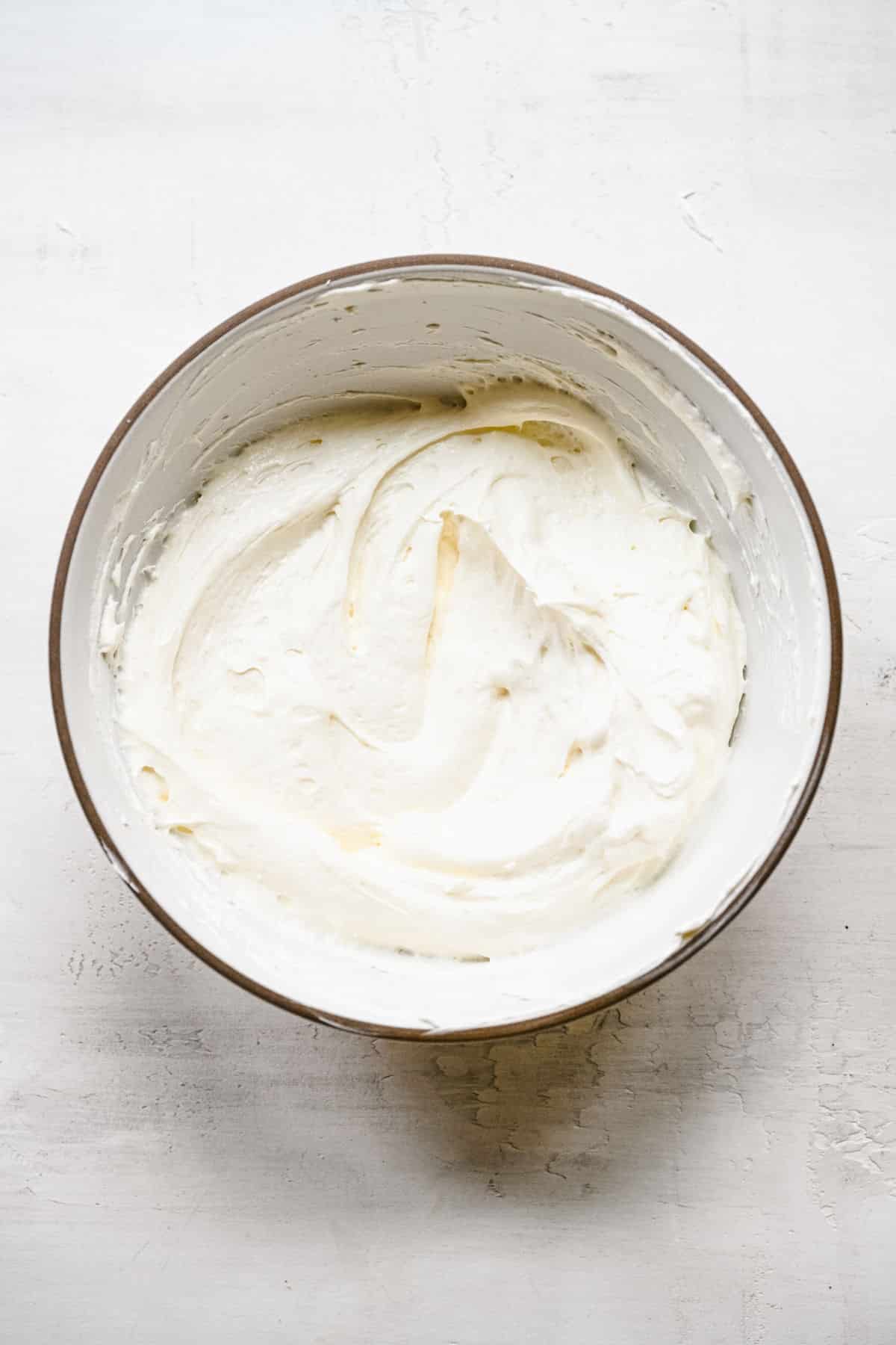 Whipped topping folded into cream cheese mixture. 